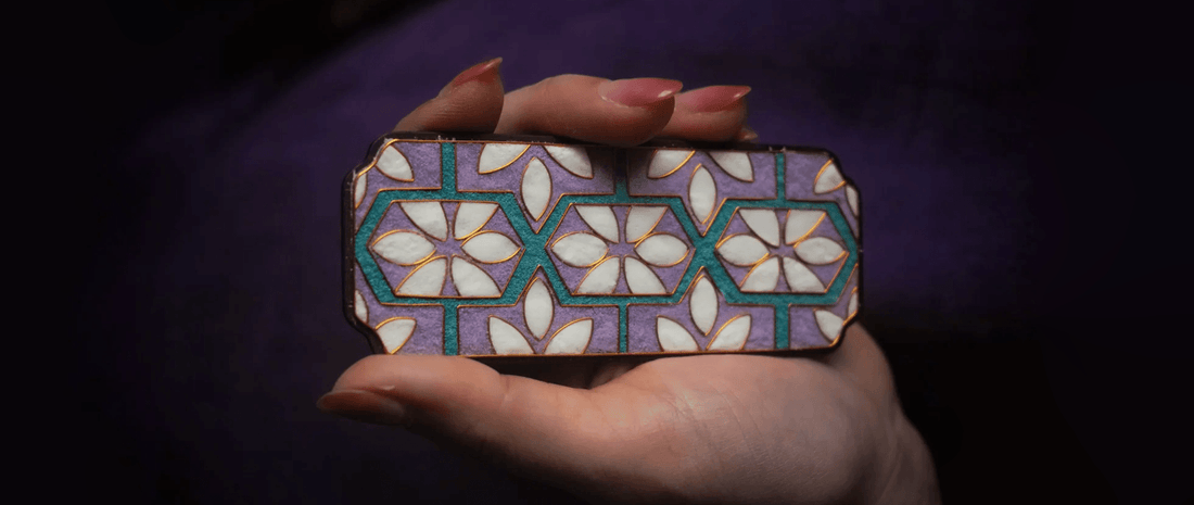 Purple cloisonné enamel jewelry piece showcasing intricate wirework and vibrant color, illustrating traditional Chinese craftsmanship