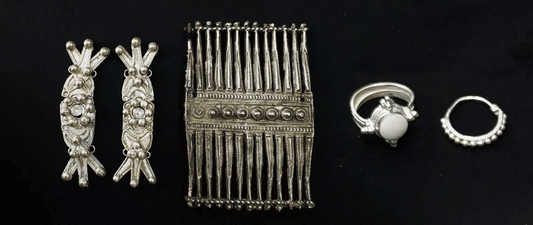 Yi silver jewelry includes headpieces, neckpieces, earrings, chest decorations, back adornments, bracelets, bangles, and rings. The patterns are often composed of sun, moon, stars, flowers, birds, plants, fish, mountains, and trees.
