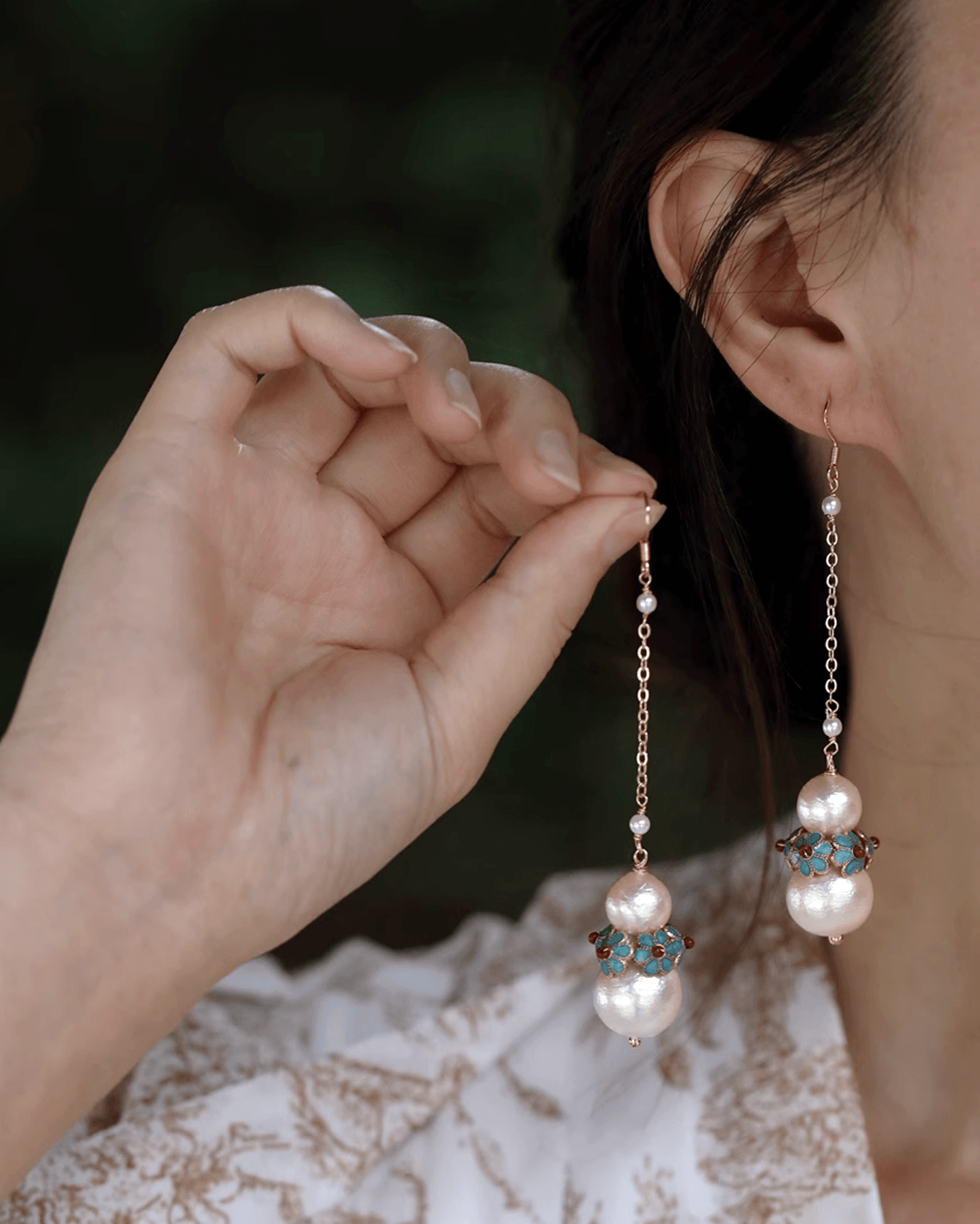 Close-up on earlobe highlighting fine craftsmanship and cultural artistry of cloisonné detail