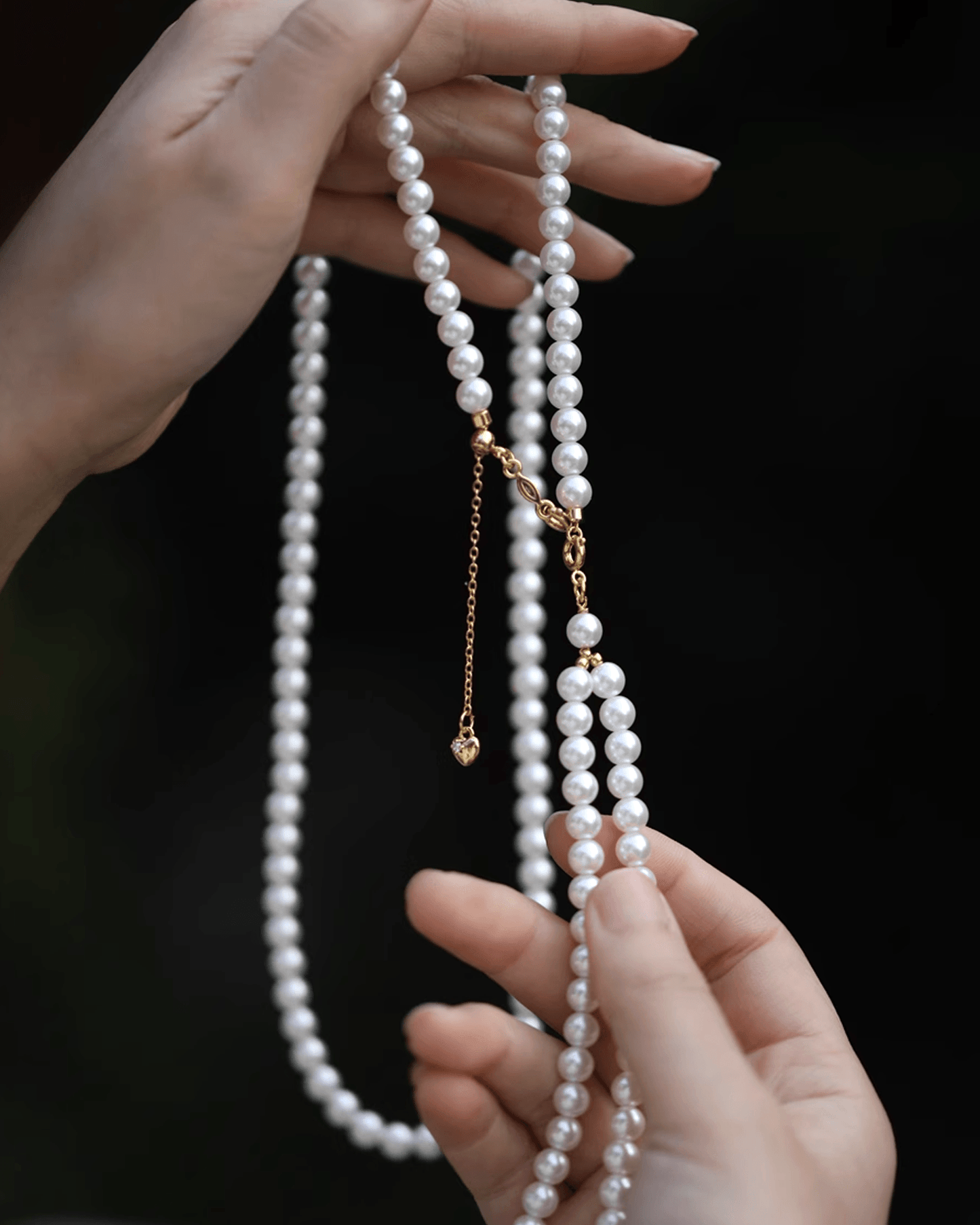 Wearing pearl strand alone with linen blazer, embodying understated elegance and coastal inspiration