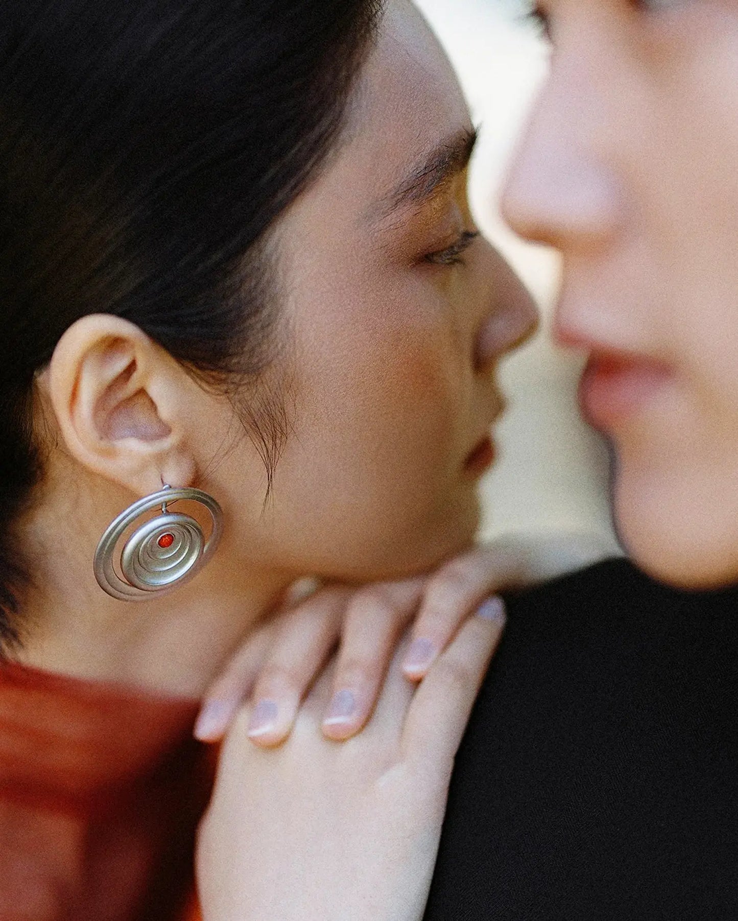 Side view of minimalist detached stud style on model, suitable for wedding or office wear
