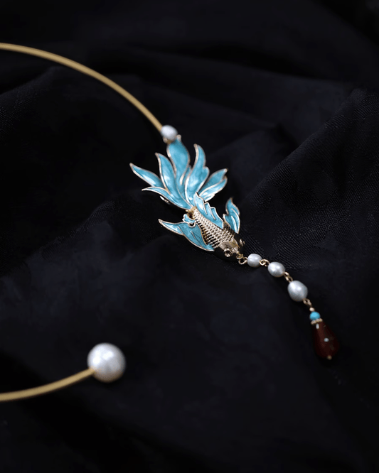 Enamel fish choker shimmering as model turns her head, mimicking water ripples