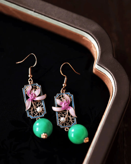 Enamel orchid earrings in gift box with rice paper and ink quote, ideal for collectors of cultural jewelry