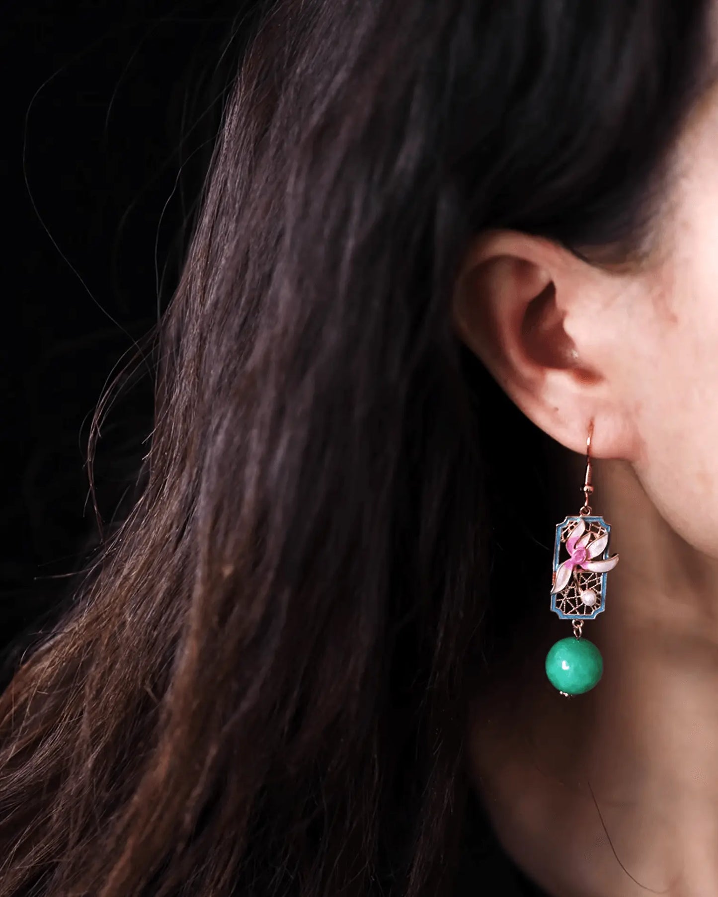 Model wearing celadon orchid earrings with linen hanfu, capturing dew-like lightness and poetic charm