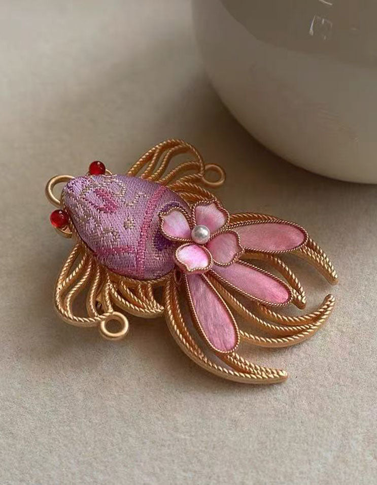 Pink textile goldfish brooch handcrafted with traditional Chinese weaving techniques