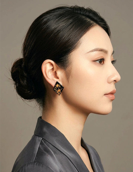 Model wearing Zolanjewelry Diamond Iris Lacquered Natural Horn Earrings with Gold Leaf