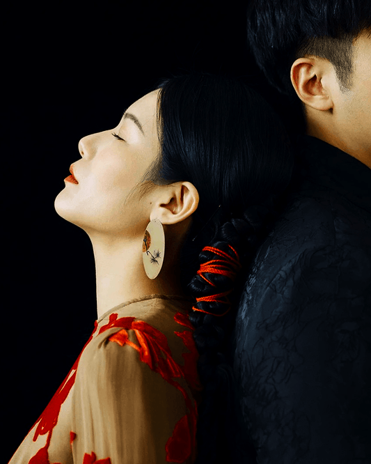 hand-painted Chinese lacquer earrings with pine and sun motif – oriental art jewelry