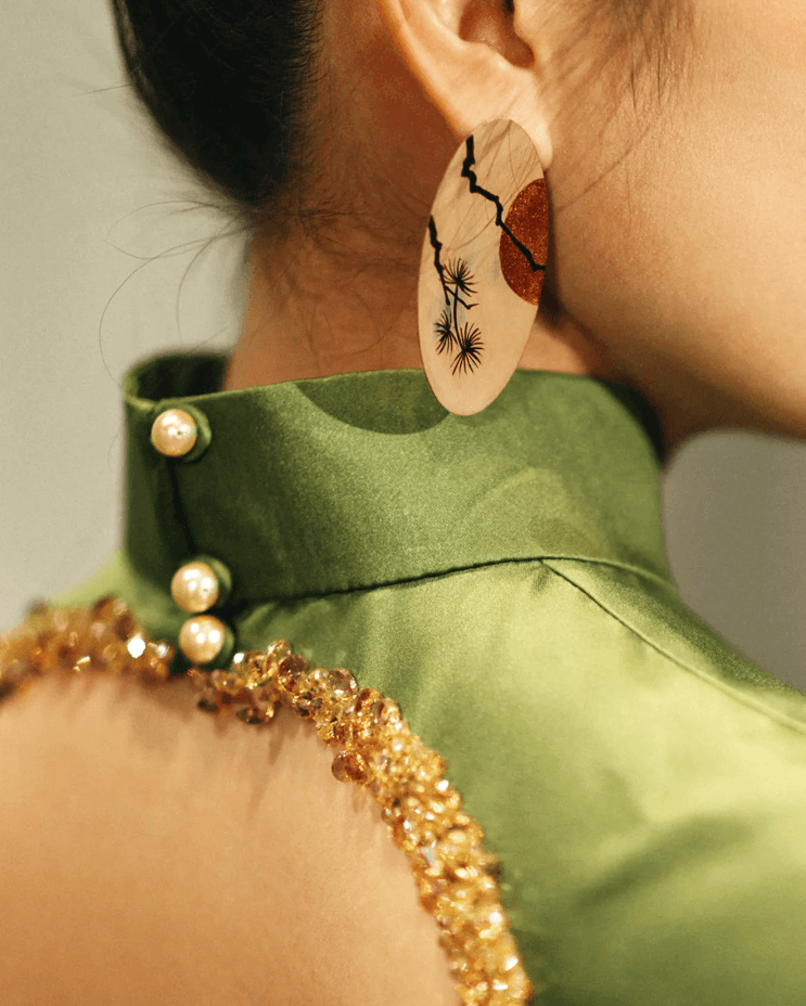 close-up of natural lacquer earrings inspired by Chinese painting