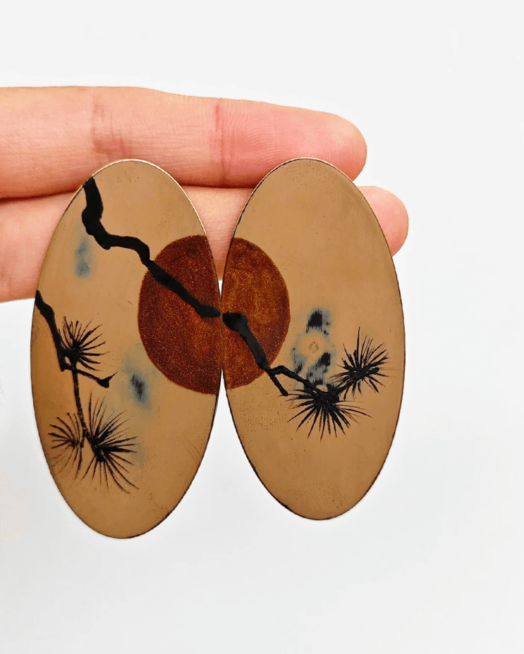 bronze oval lacquer earrings with symbolic sun and pine design