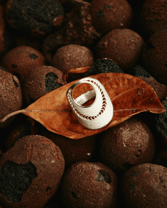 close-up of handcrafted filigree silver statement ring – modern oriental design
