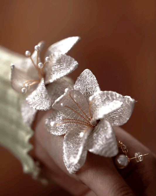Close-up of 3D silver mesh petals showing light and shadow play, mimicking silk-screen illusions
