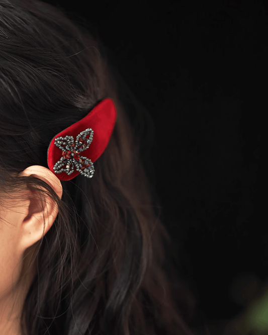 Side profile of modern updo enhanced with ombré velvet clip, shimmering crystals catching light