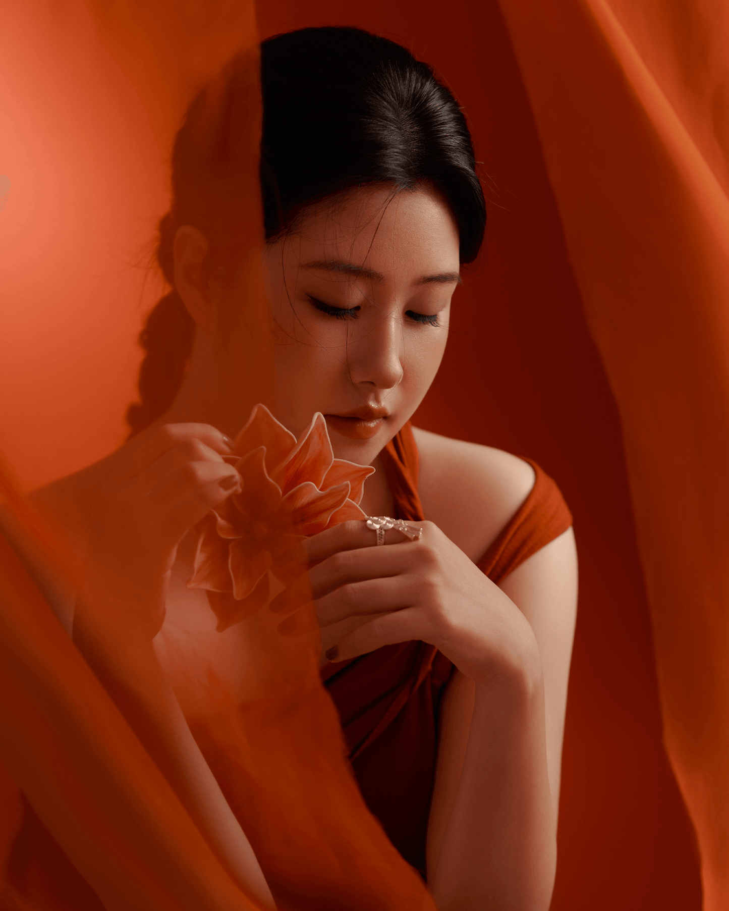 Side view of silver bell ring worn with Modern clothing, merging ethnic tradition with modern minimalism