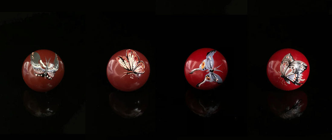 Elegant butterfly stud earrings hand-painted with traditional Chinese lacquer, showcasing vibrant colors and intricate craftsmanship.