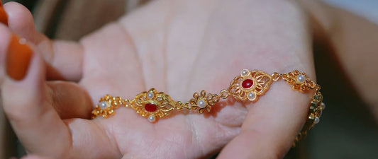 Huasi xiangqian bracelet featuring traditional Chinese filigree workmanship and delicate gold wire inlay design