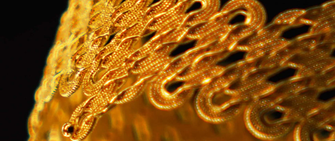 metal filigree threads resemble a protective network.