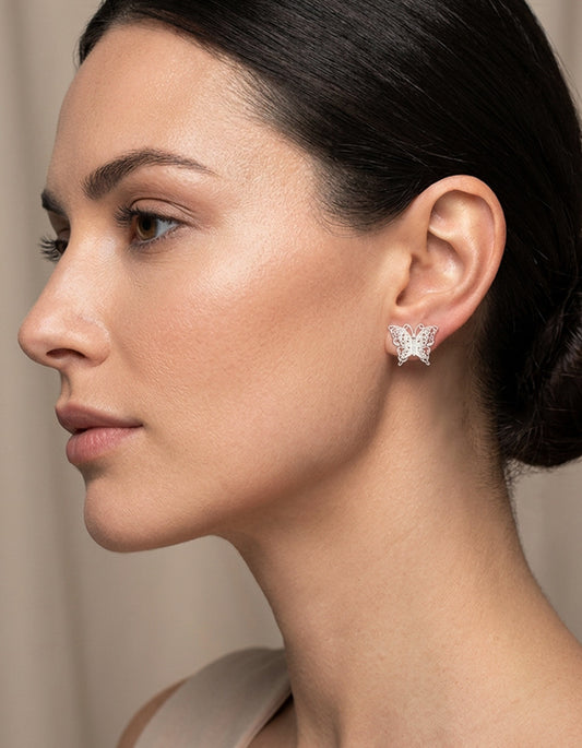 model wearing zolanjewelry 999 Silver Filigree Butterfly Earrings.
