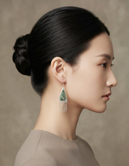 Model wearing Bamboo Green Triangle Earrings crafted with traditional Chinese Song Brocade textile craftsmanship