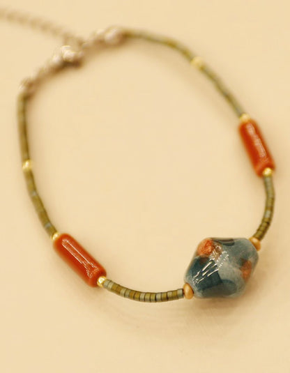Close-up of ceramic bead bracelet from ZolanJewelry new collection, inspired by traditional Chinese aesthetics and handcrafted jewelry design.