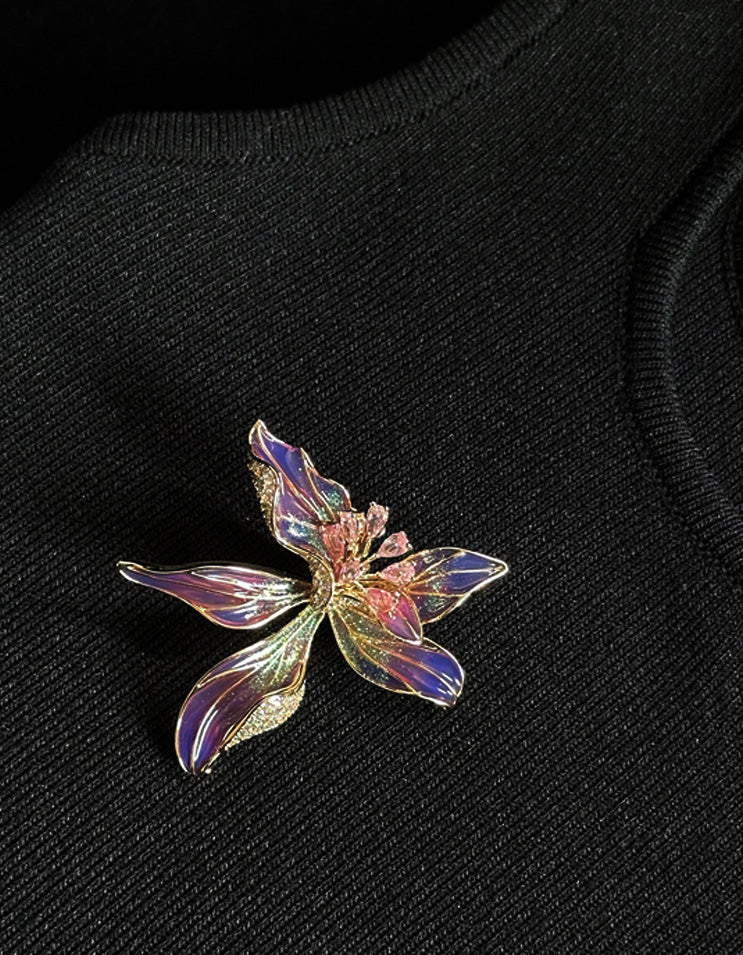 Flat lay of handcrafted Chinese cloisonne enamel iris brooch pin , inspired by Chinese ink-wash paintings and spring blossoms