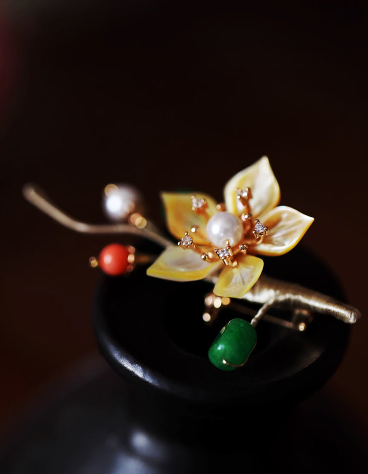 Handcrafted Chinese plum blossom brooch pin carved from iridescent mother-of-pearl