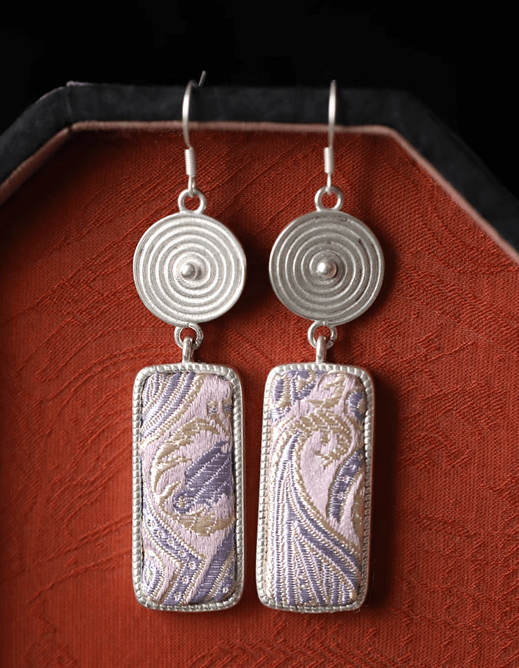 Handcrafted Chinese textile jewelry featuring Song brocade and sterling silver tassels. Lightweight drop earrings inspired by ancient Suzhou canals.