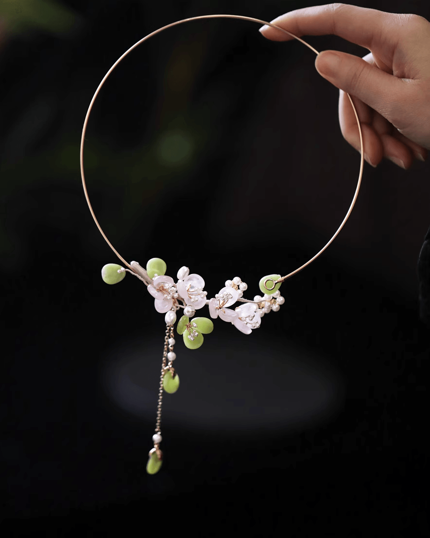 Detail shot of natural rose quartz beads with soft blush tones, translucent polished finish as a piece of chinese jewelry