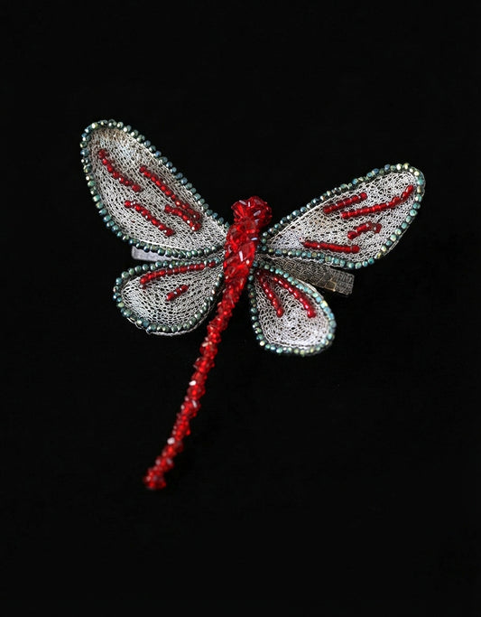 Handcrafted silk embroidered dragonfly hair clip inspired by Eastern gardens. Made with ultra-fine silk threads & a secure non-slip spring clip. Shop today.