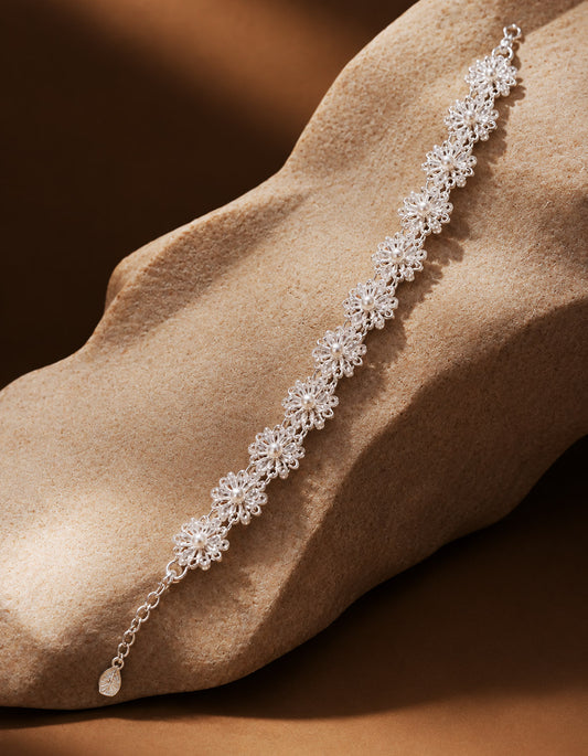 Inspired by the serene beauty of blooming summer lotuses, the Double Lotus Bracelet captures the refined essence of Eastern natural aesthetics. Its thoughtful dual-layer design beautifully mimics overlapping petals, with intricate filigree lines meticulously tracing delicate botanical veins