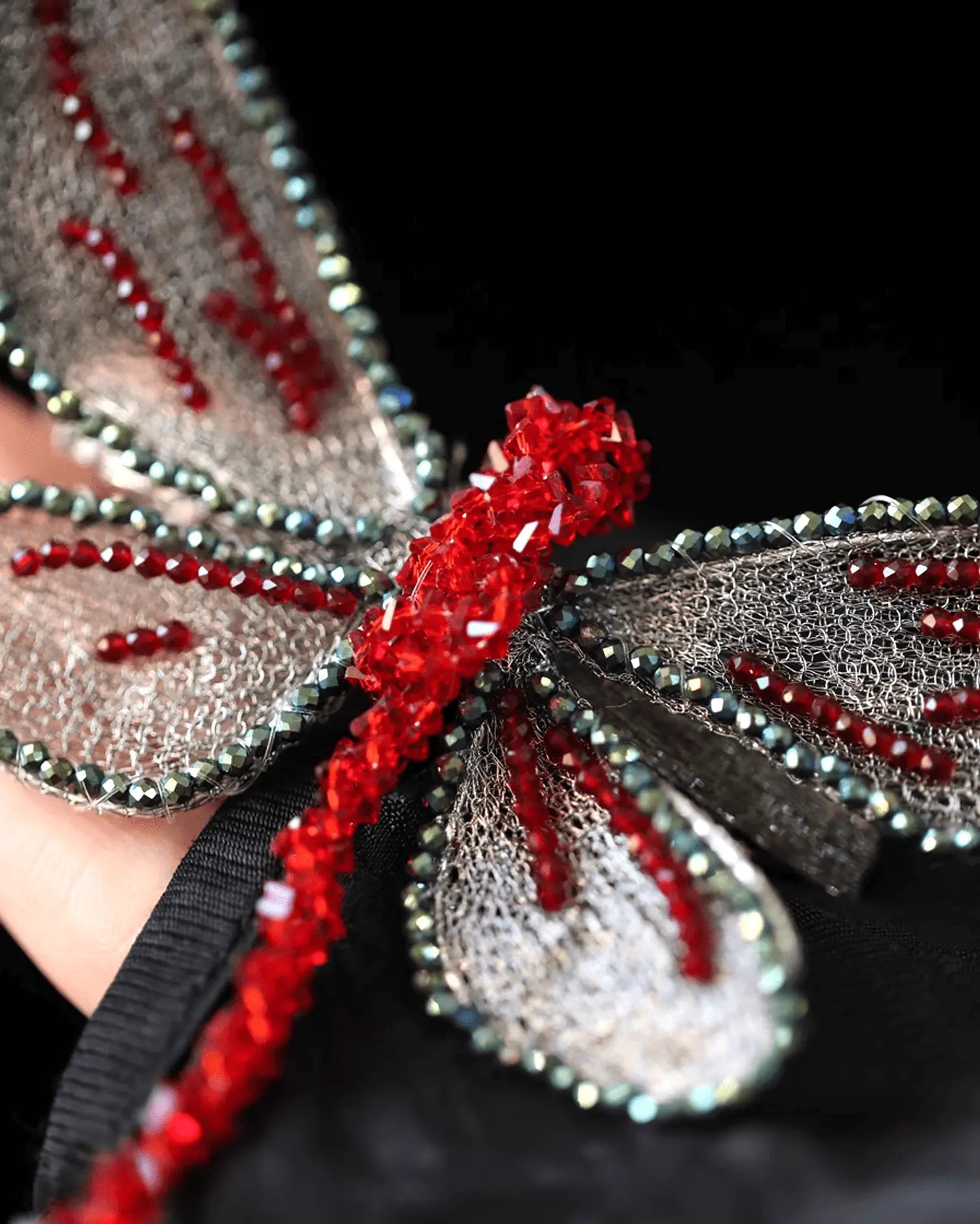 Close-up of silk embroidery dragonfly wings, mimicking motion with layered stitching and gradient shine