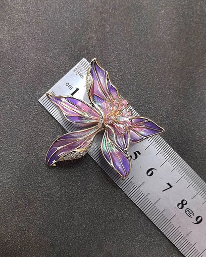 Close-up of hand-fired enamel petals with vibrant blue and purple strokes, resembling watercolor brushwork