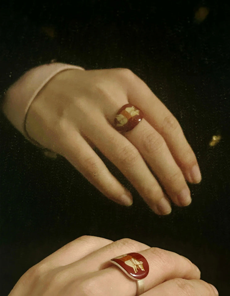 Model wearing the Red-Gold Maned Horse lacquer ring on hand, highlighting the sculptural form, rich lacquer texture, and red-gold tones of handcrafted Chinese lacquer jewelry.
