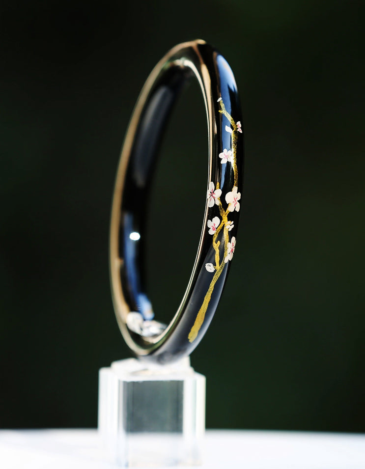 Elegant sakura-themed gilded lacquer bracelet combining traditional da qi technique with contemporary jewelry design by ZolanJewelry