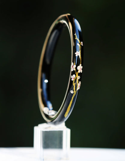 Elegant sakura-themed gilded lacquer bracelet combining traditional da qi technique with contemporary jewelry design by ZolanJewelry