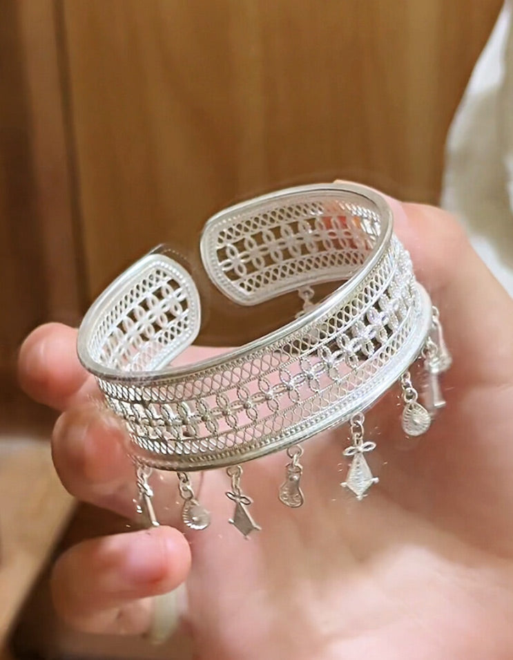 Full view of a pure silver filigree tassel bracelet, blending traditional Chinese filigree techniques with a refined modern silhouette