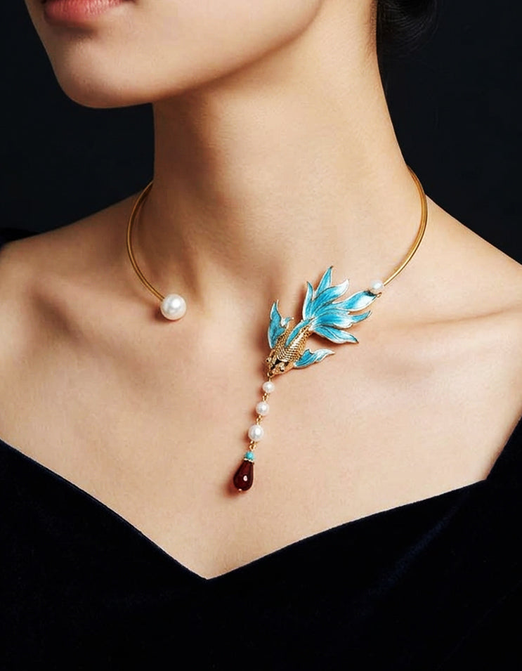 Flat lay of zolanjewelry cloisonné enamel choker with filigree silk threads and fish-scale motif, inspired by mythical Chinese peacock fish