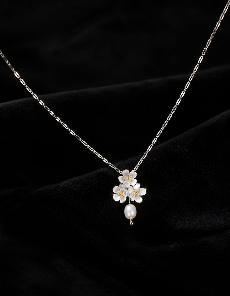 Zolanjewelry's sterling silver jasmine flower necklace with a freshwater pearl, minimalist collarbone chain.