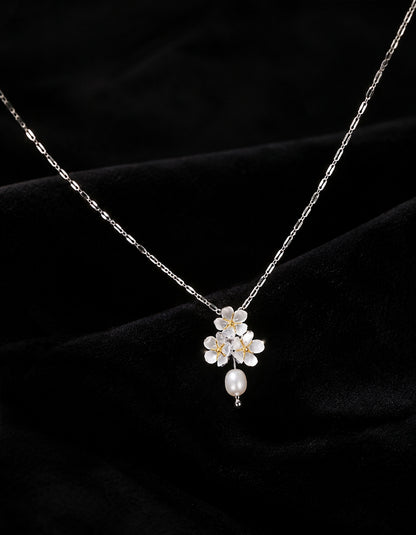 Zolanjewelry's sterling silver jasmine flower necklace with a freshwater pearl, minimalist collarbone chain.
