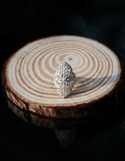 Hand-chiseled Liangshan Yi ethnic fine silver open band ring. Features geometric lattice pattern handcrafted by heritage huasixiangqian silvercraft masters.