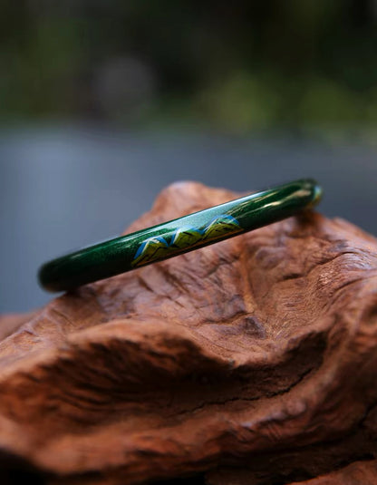 View of Zolanjewelry A Thousand Li Chinese Lacque Bangle, Crafted from the rare, natural sap of Asian lacquer trees (Da Qi), every stroke of azure and malachite green is meticulously hand-rendered.