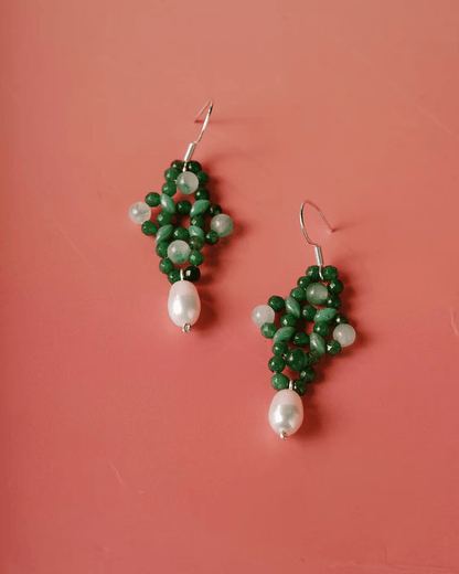 Flat lay of green aventurine knot earrings with hand-tied Chinese knot design, symbolizing unity and intention