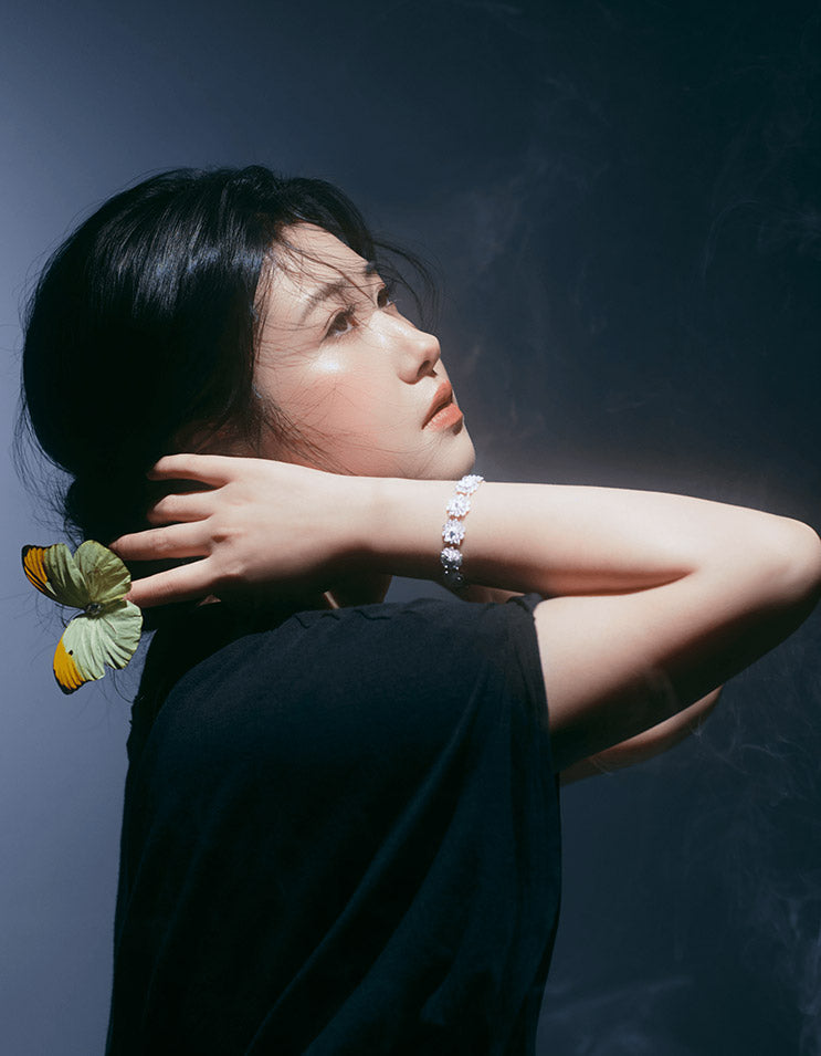 Model wearing Double Lotus Chinese Filigree Sterling Silver Bracelet, showcasing elegant layered lotus design