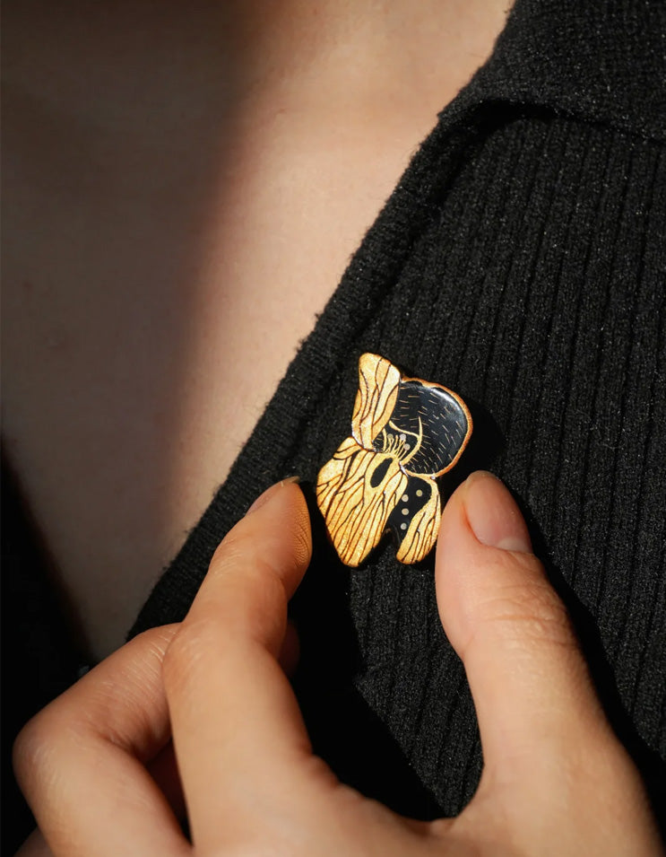 Chinese lacquer iris brooch inspired by traditional East Asian painting, handcrafted art jewelry