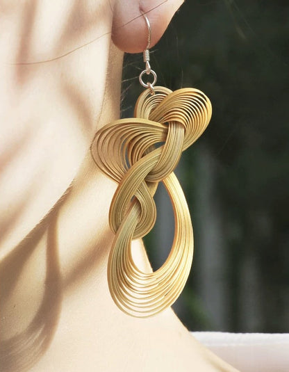 Natural bamboo-woven earrings showcasing original bamboo texture and silver detail