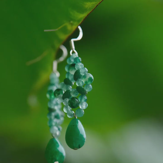 Close-up of aventurine knots swaying gently with head movement, reflecting natural harmony